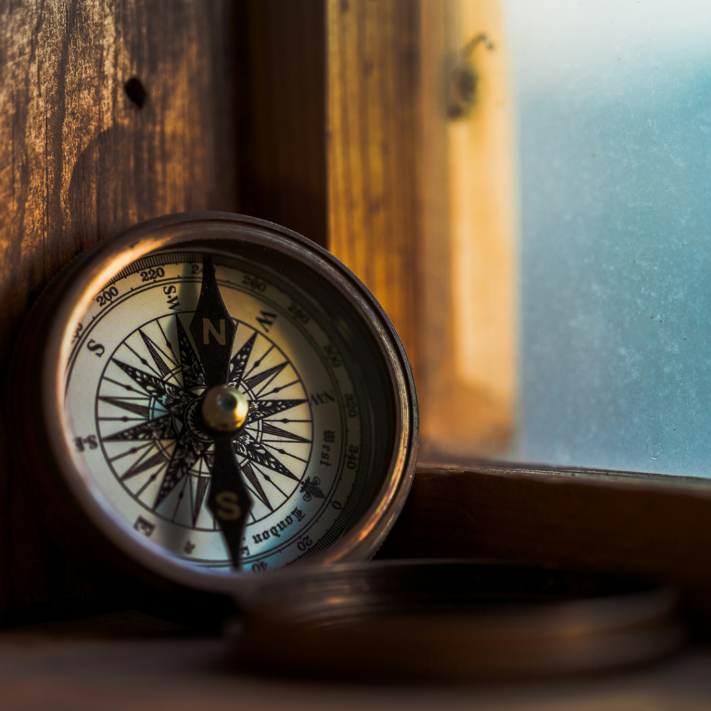 Compass on a window sill. The compass represent Justice as a guide for life.