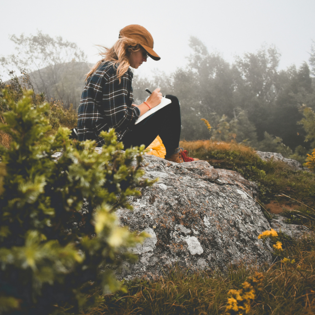 Woman writing in a journal like Marcus Aurelius