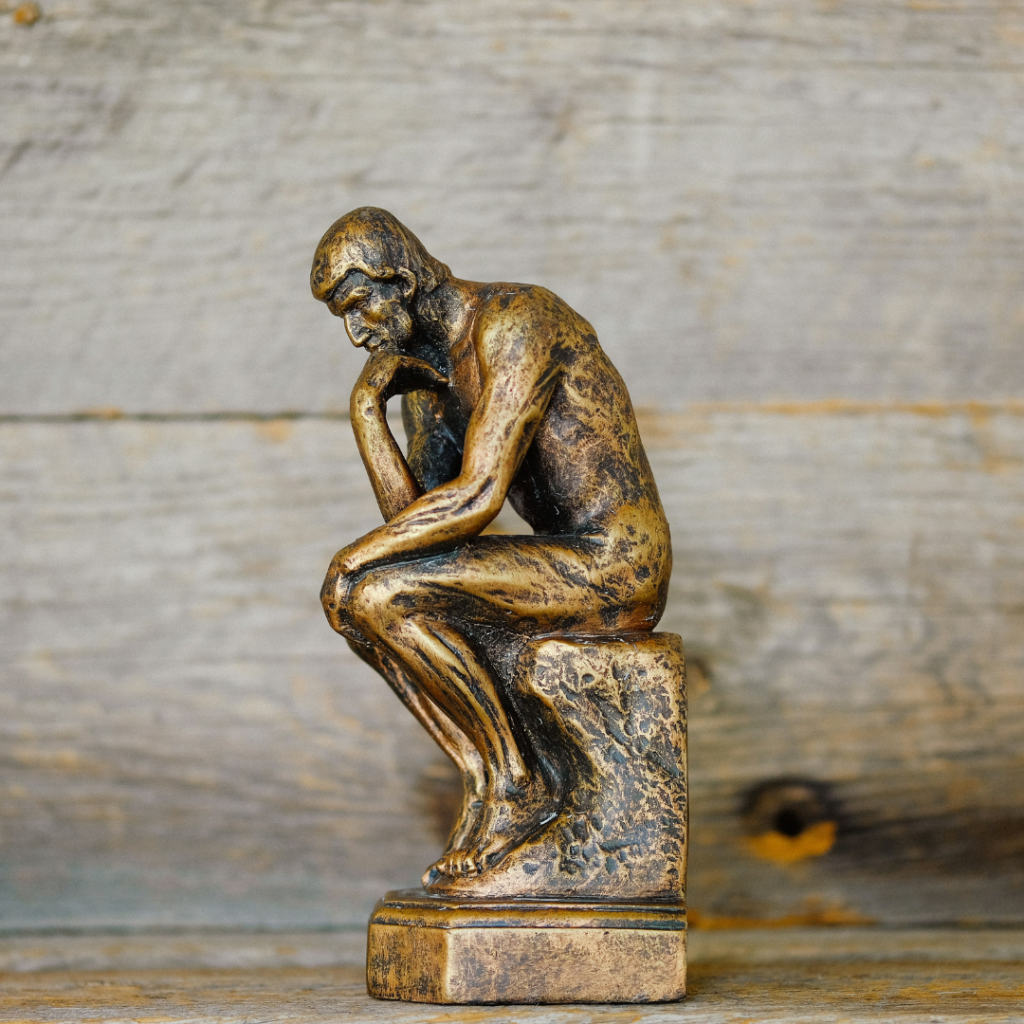 Statue of the thinker, pondering over life.