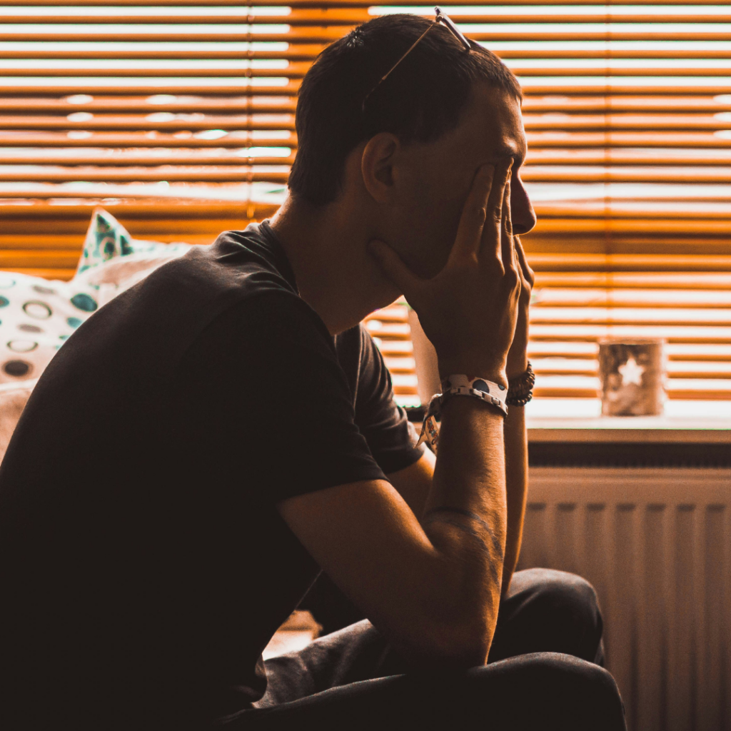 Man sitting in doubt.