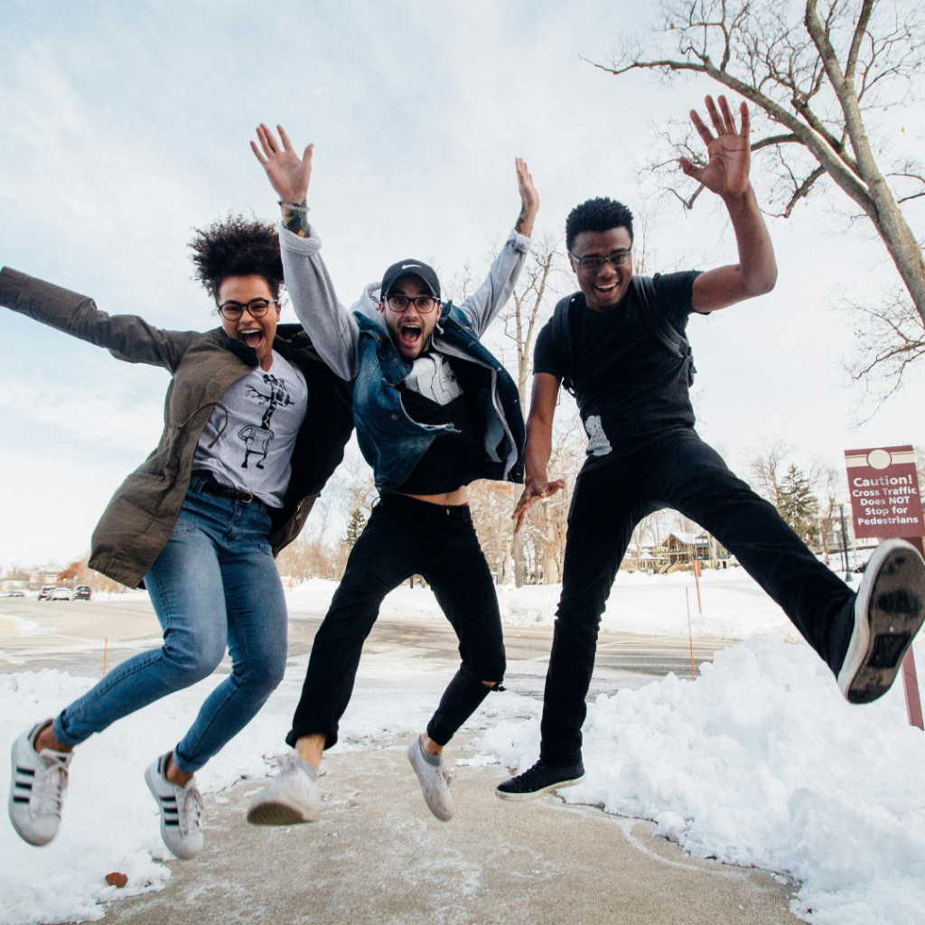 Three friends jumping in the air