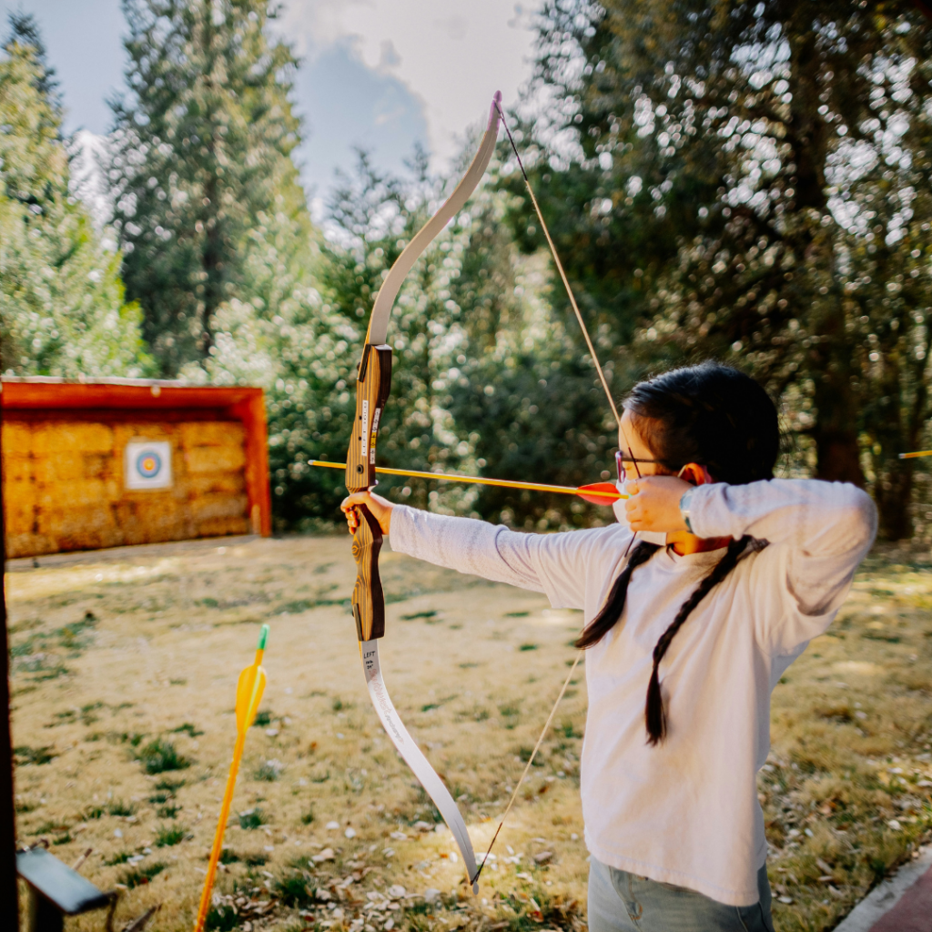 Archer aims at the target.