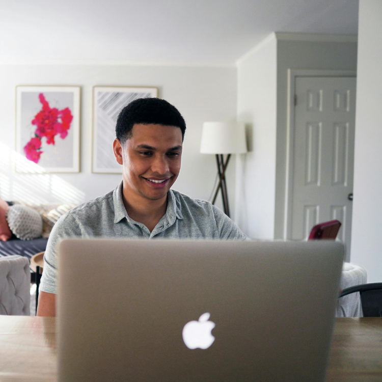 A man working on his laptop.