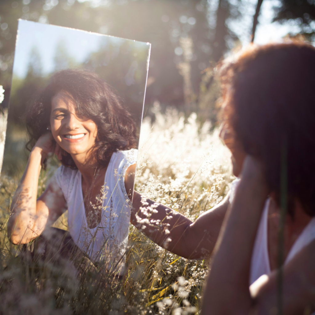 Woman looking in a mirror.