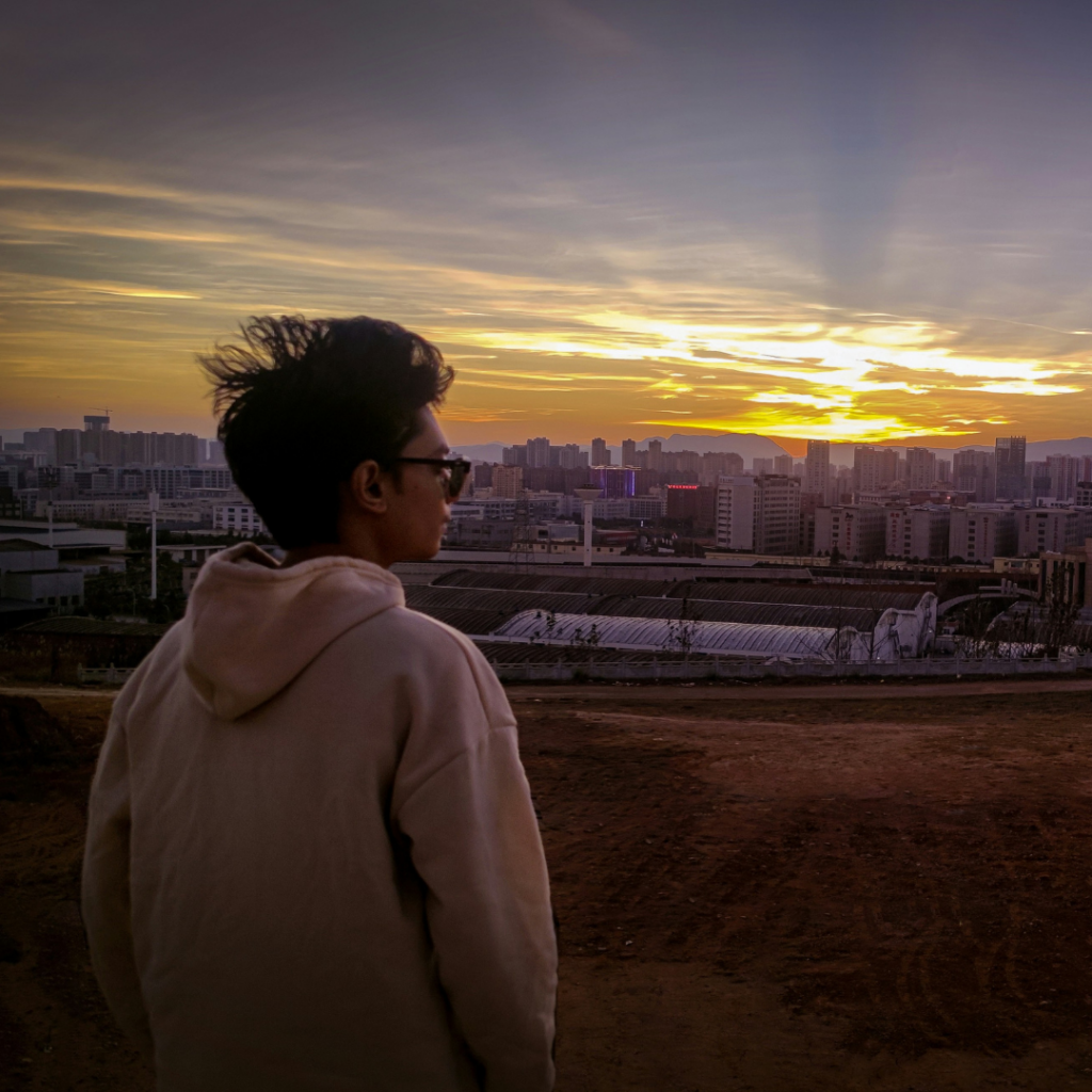 Person looking at the sunrise