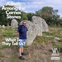 Benny standing beside the Carnac stones in Brittany, a Stoic lesson on purpose from the Via Stoica Podcast